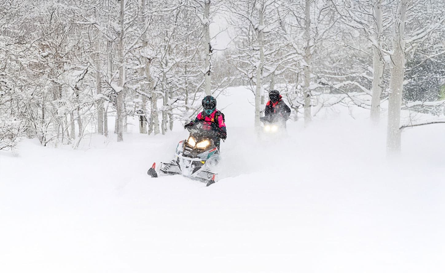 2 Riders on Polaris 550 RMK Evo 144