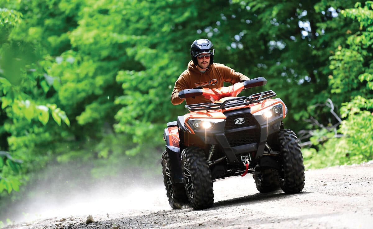 ATV rider on a dirt road