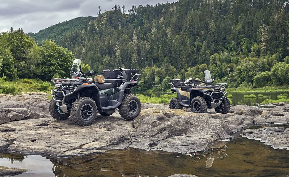 ATVs, parked on rocks